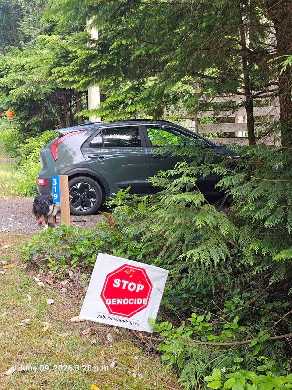 Stop Genocide sign at 319 Malaspina Drive, Gabriola