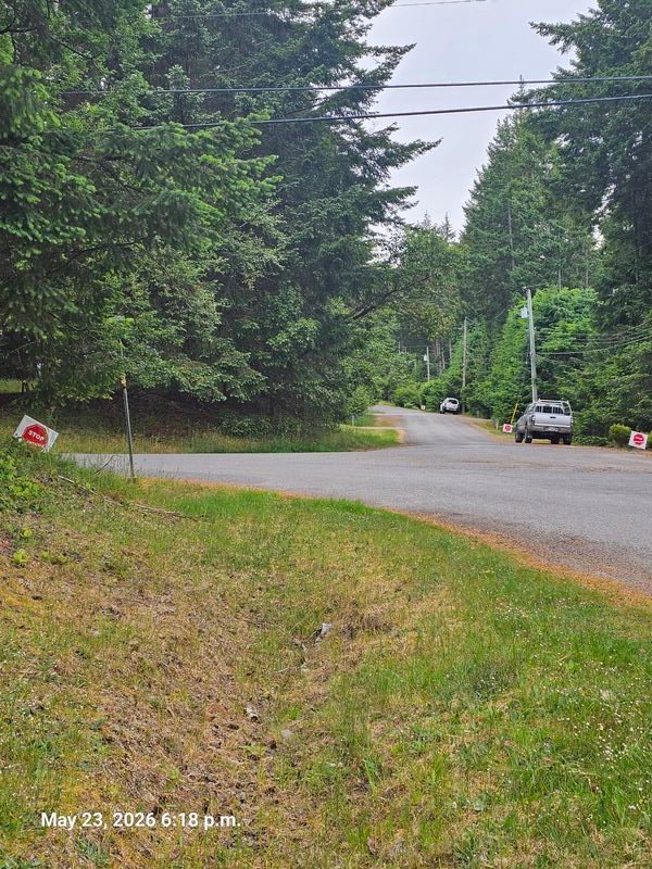 Six Stop Genocide signs in a row on Wild Cherry Terrace, Gabriola