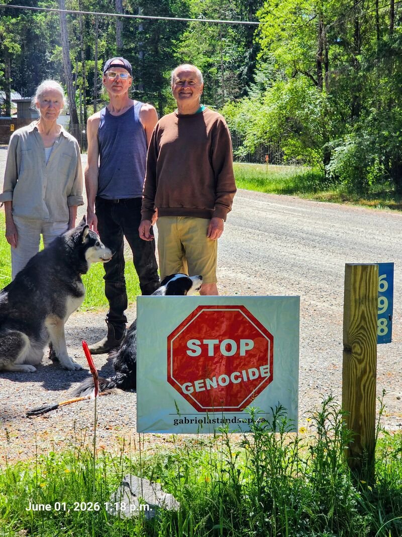 Bruce and family with their Stop Genocide sign on Dogwood Crescent, Gabriola