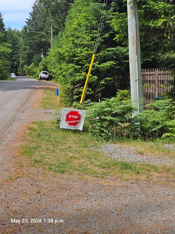 Claudia's Stop Genocide sign on Wild Cherry Terrace, Gabriola