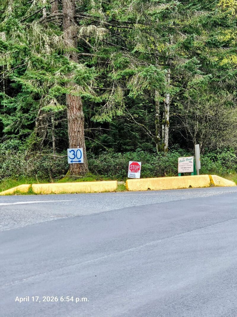 Stop Genocide sign at corner of Barrett and North Road, Gabriola