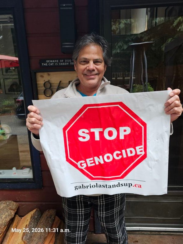 Dodge with his Stop Genocide sign on North Road, Gabriola