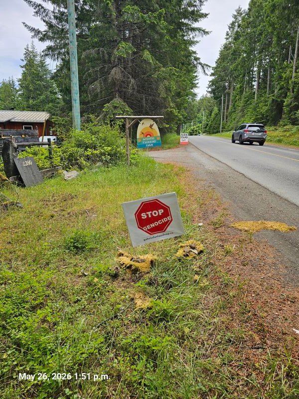 Elena's Stop Genocide sign on North Road, Gabriola