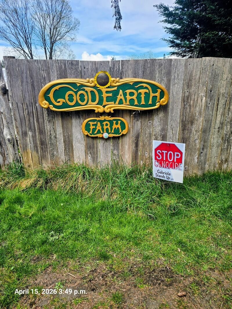 Stop Genocide sign at Good Earth Farm, Gabriola
