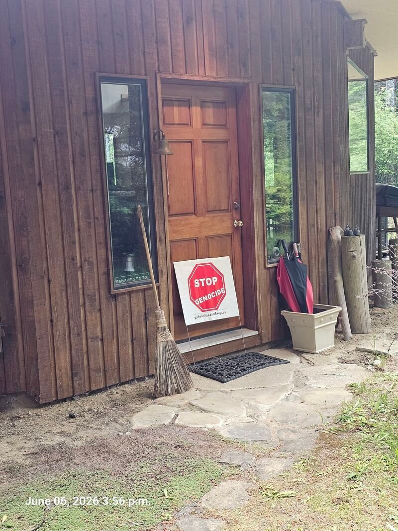 Howie's Stop Genocide sign at Perry Road, Gabriola