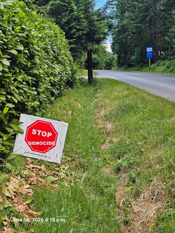 Ivan's Stop Genocide sign on North Road, Gabriola