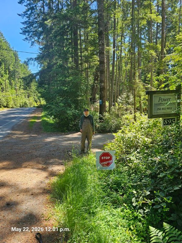 Jerry with his Stop Genocide sign on North Road, Gabriola