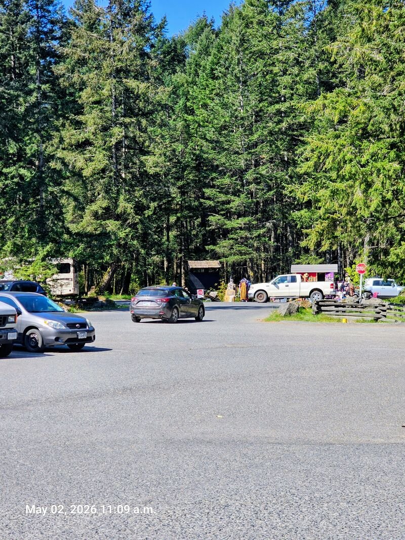 Stop Genocide sign visible outside Nesters Market parking lot, Gabriola Island