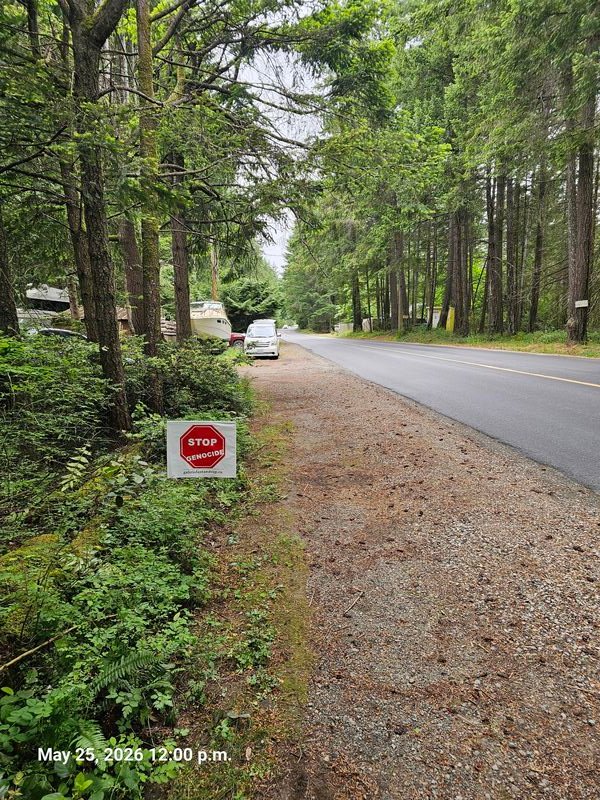 Rob's Stop Genocide sign on North Road, Gabriola