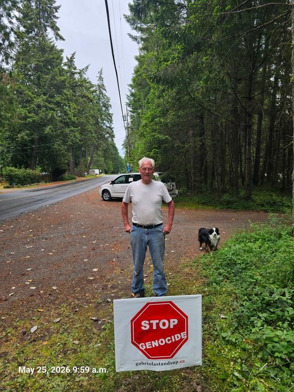Wayne with his Stop Genocide sign on North Road, Gabriola
