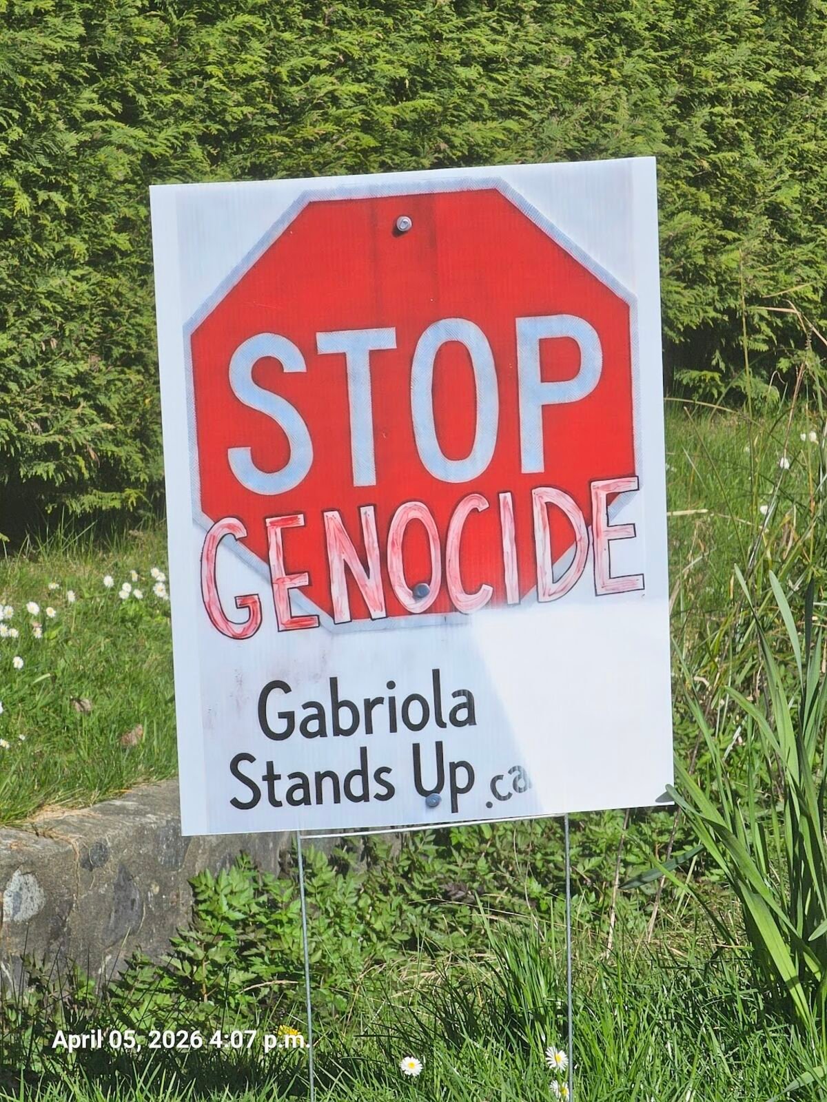 Stop Genocide — Gabriola Stands Up lawn sign